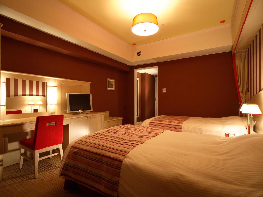Postel nebo postele na pokoji v ubytování Hotel Monterey Kyoto