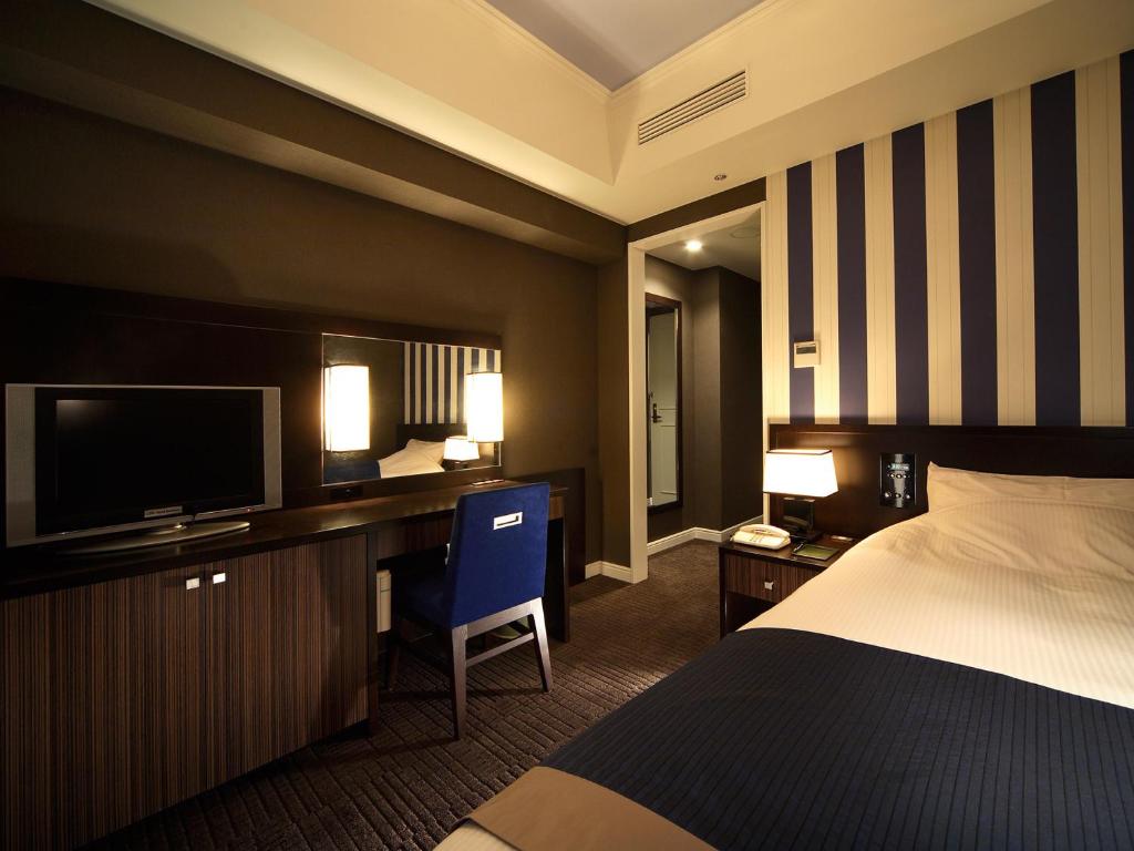 Postel nebo postele na pokoji v ubytování Hotel Monterey Kyoto