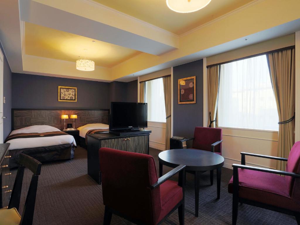 Postel nebo postele na pokoji v ubytování Hotel Monterey Kyoto