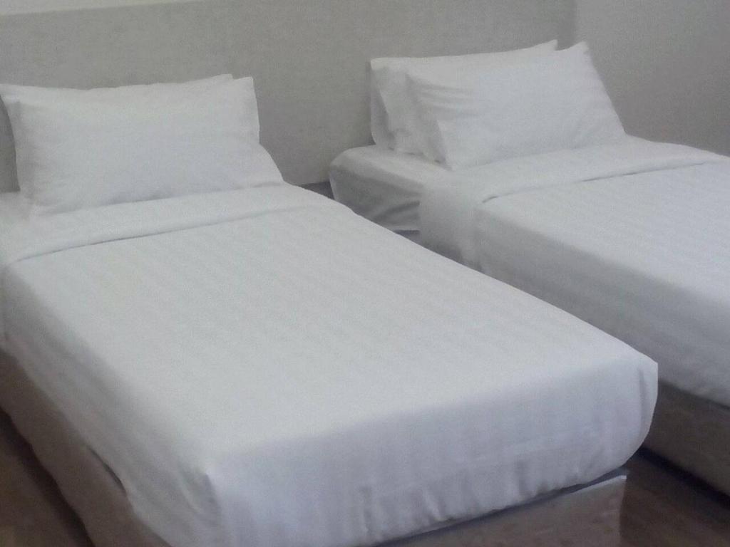 Postel nebo postele na pokoji v ubytování 1ACS Residence