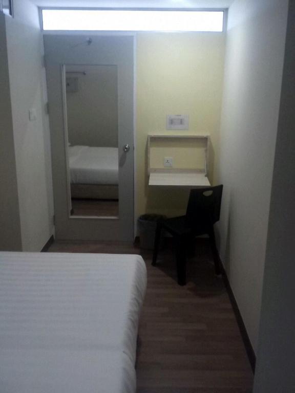 Postel nebo postele na pokoji v ubytování 1ACS Residence