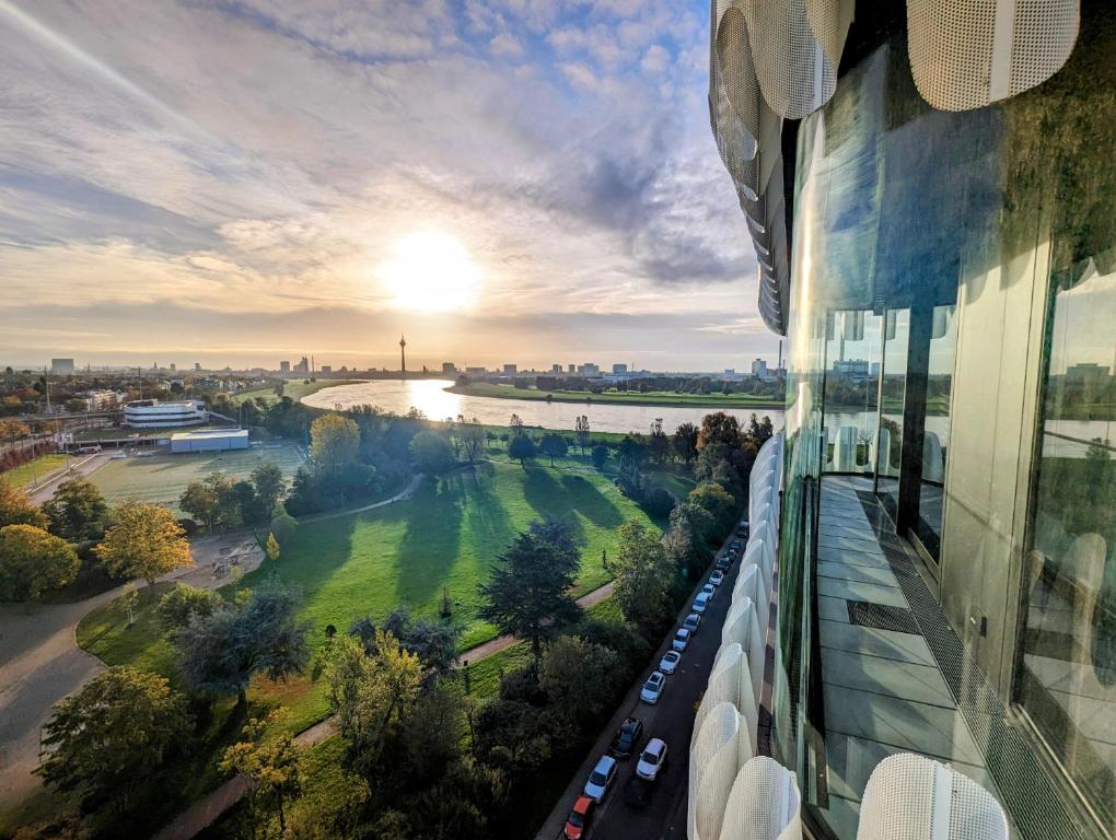 a view of a river from a building at The Zipper Hotel und Apartments in Düsseldorf