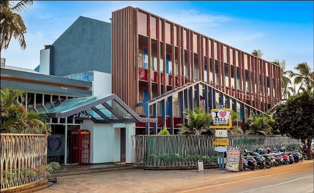 a building with motorcycles parked in front of it at I Love Bell Bottoms Vagator Goa in Anjuna