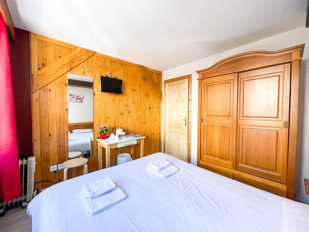 Postel nebo postele na pokoji v ubytování Atmosphere Hotel