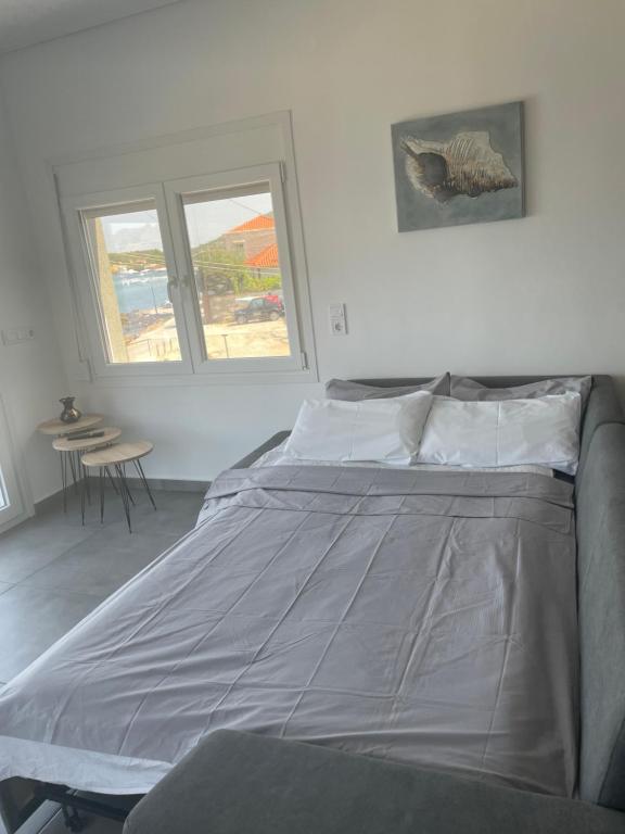 Postel nebo postele na pokoji v ubytování Seafront Apartment