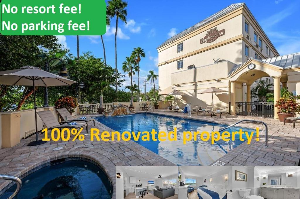 a picture of a swimming pool in front of a building at Bayfront Inn 5th Avenue in Naples