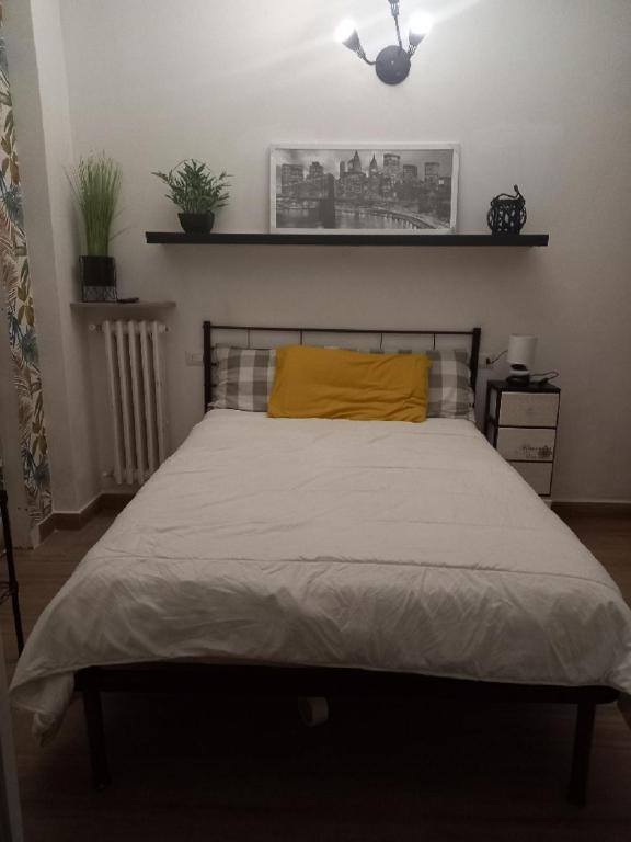 Postel nebo postele na pokoji v ubytování il cortile dei 3 camera matrimoniale