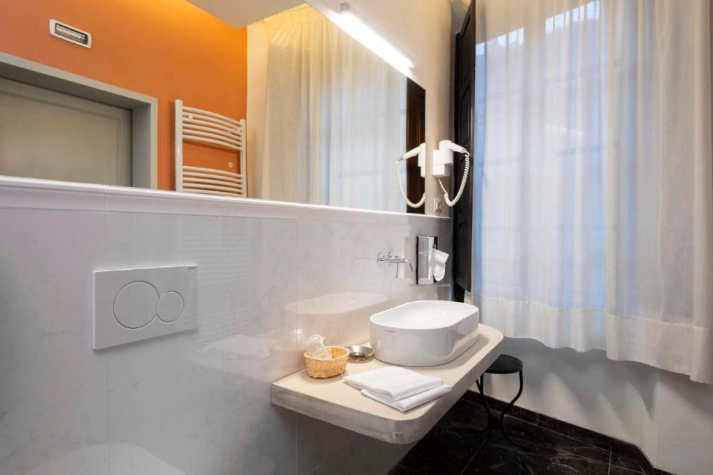 Koupelna v ubytování Hotel L'Antico Pozzo