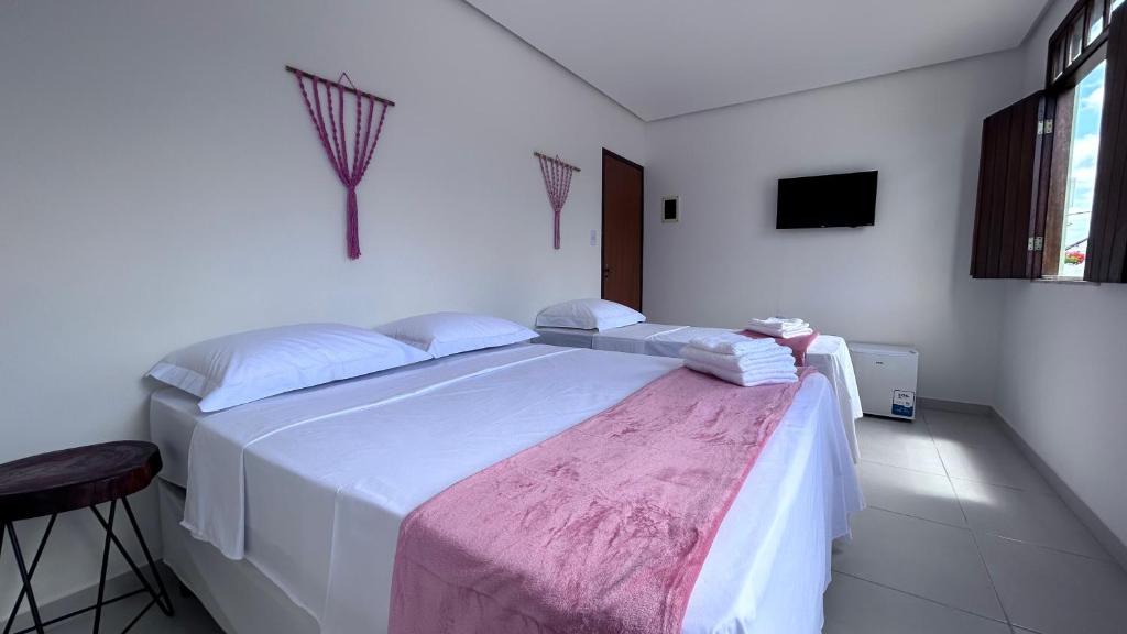 Cama ou camas em um quarto em Pousada Estrelar