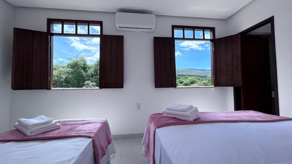 Cama ou camas em um quarto em Pousada Estrelar