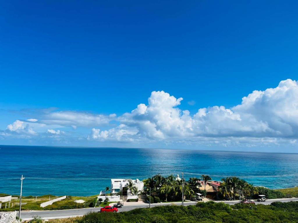 a view of the ocean on a sunny day at Holiday apartment at La Diosa condos Isla Mujeres in Isla Mujeres