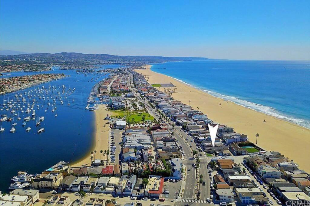 an aerial view of a beach with boats in the water at Steps from the Sand-Rooftop Spa-Incredible Views in Newport Beach