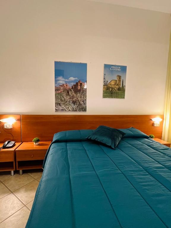 Postel nebo postele na pokoji v ubytování Hotel Vico Alto Siena