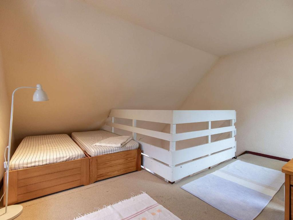 a small attic room with a bed and shelves at Appartement Luz-Saint-Sauveur, 1 pièce, 5 personnes - FR-1-402-136 in Luz-Saint-Sauveur