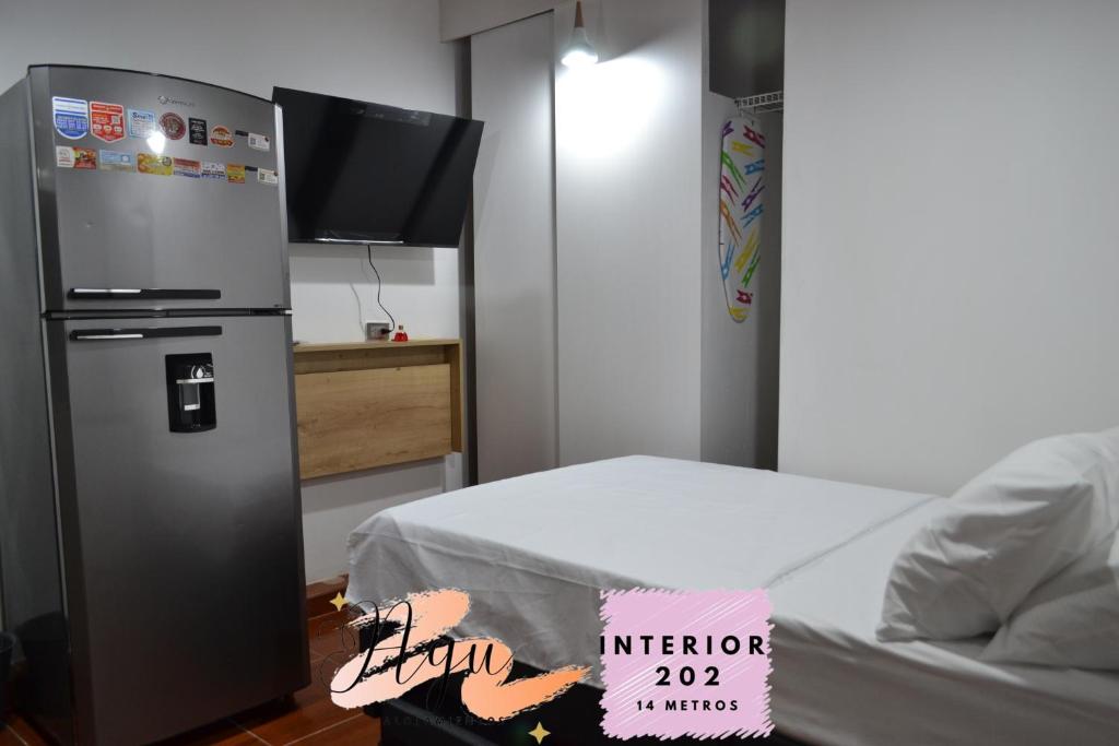 Postel nebo postele na pokoji v ubytování Apartaestudio en Envigado