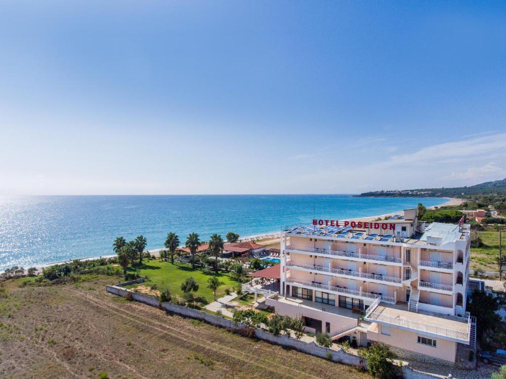 an aerial view of a hotel next to the ocean at Poseidon Beach Hotel in Kastrosikia