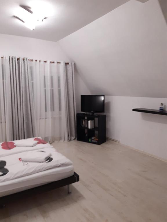 Posteľ alebo postele v izbe v ubytovaní Biały apartament