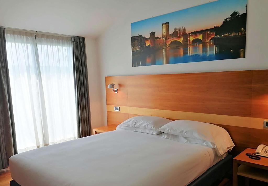Postel nebo postele na pokoji v ubytování Best Western Hotel Fiera Verona