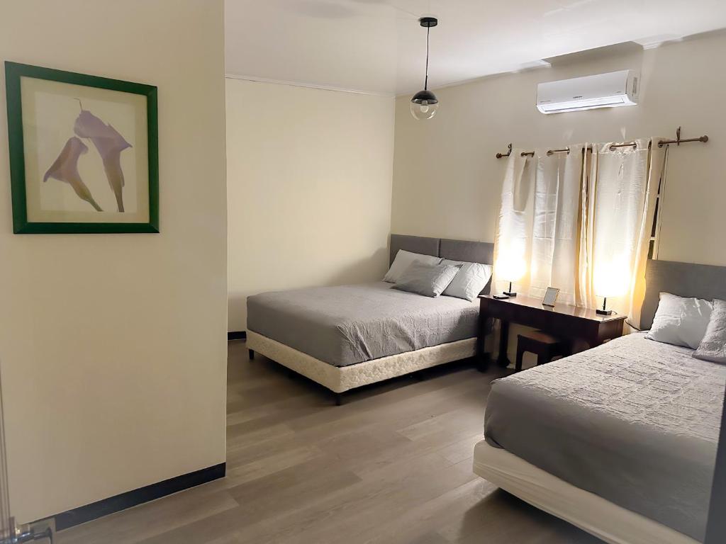 Postel nebo postele na pokoji v ubytování Helechos Hotel