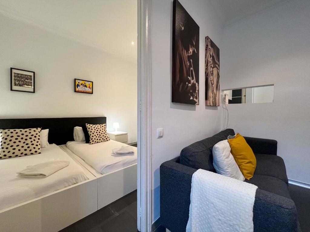 Postel nebo postele na pokoji v ubytování Stay Unique Apartments Cent