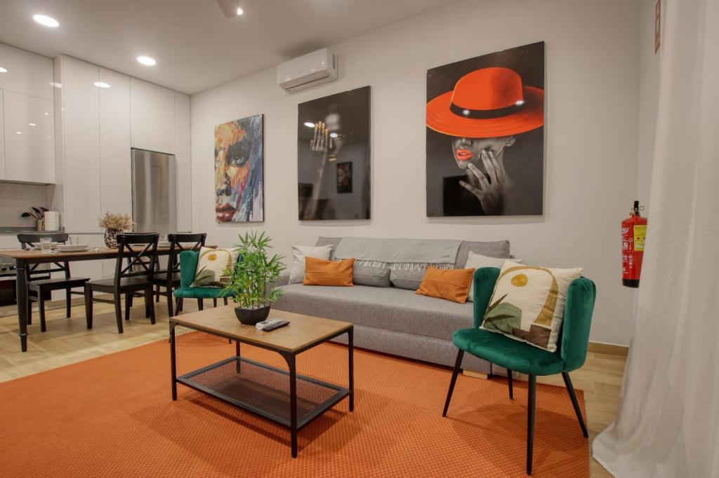 a living room with a couch and a table at Literato centro de la ciudad in Murcia