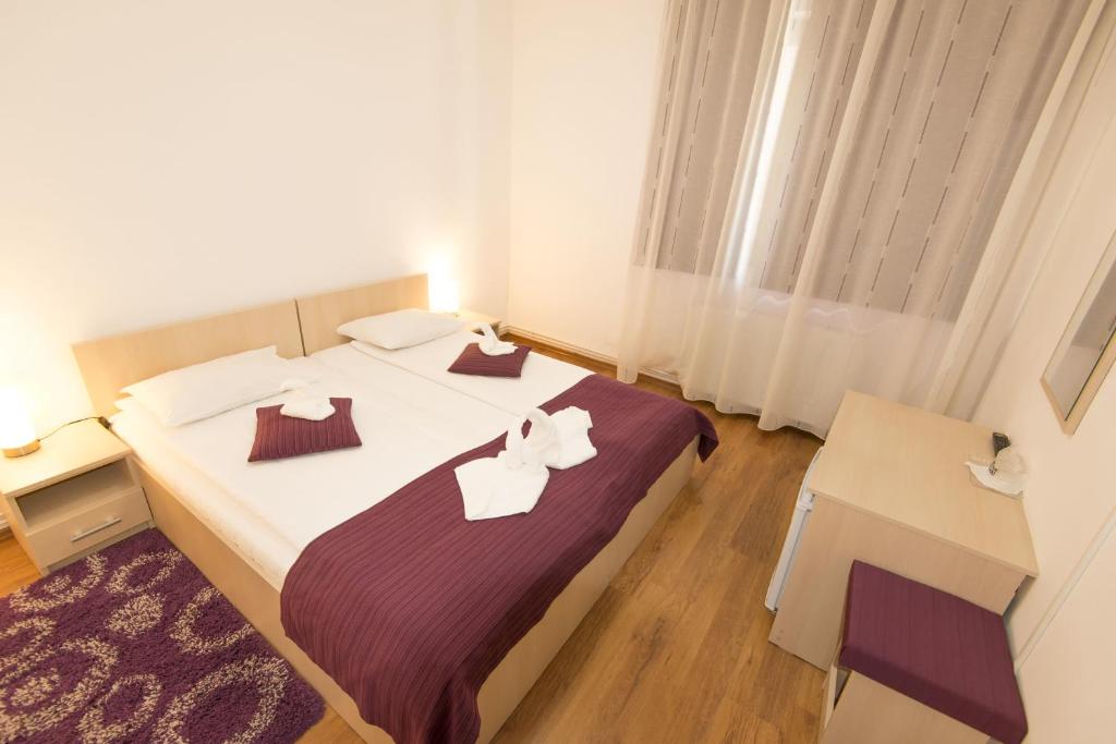 Postel nebo postele na pokoji v ubytování Vila Rigo Sovata