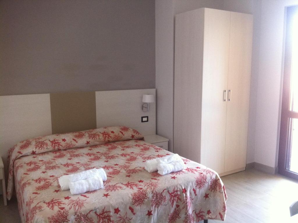 Postel nebo postele na pokoji v ubytování Meublé Leonetti