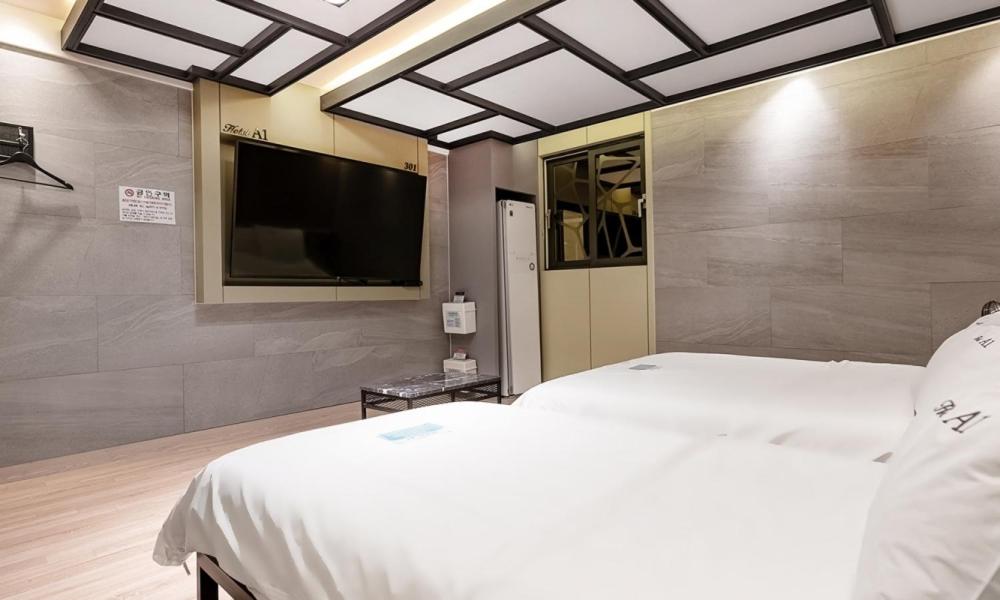 Postel nebo postele na pokoji v ubytování Pohang A1 Hotel Yeongildae Branch