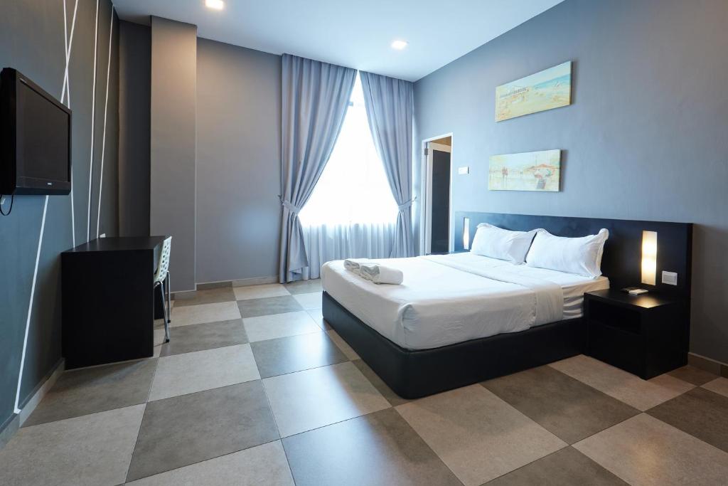 Elite Hotel Muar客房内的一张或多张床位