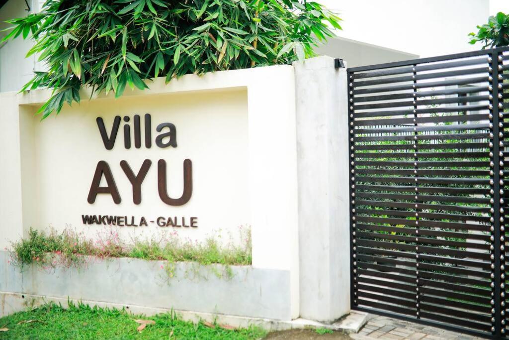 a sign for a villa avu villa villa gate at Villa Ayu in Galle