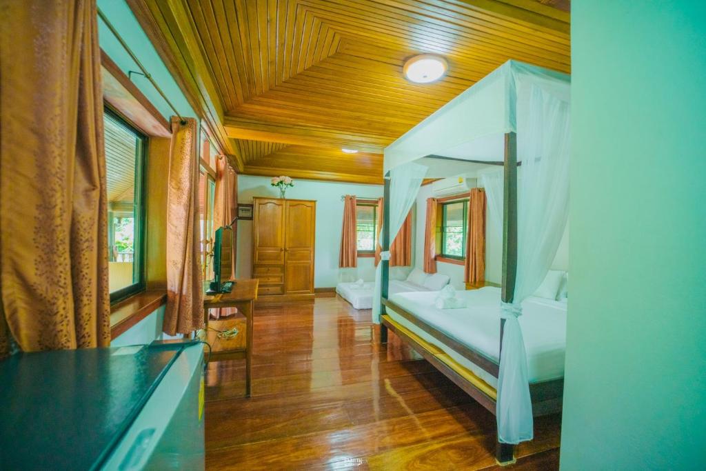 Postel nebo postele na pokoji v ubytování Siam Tara Resort Chiangkhong