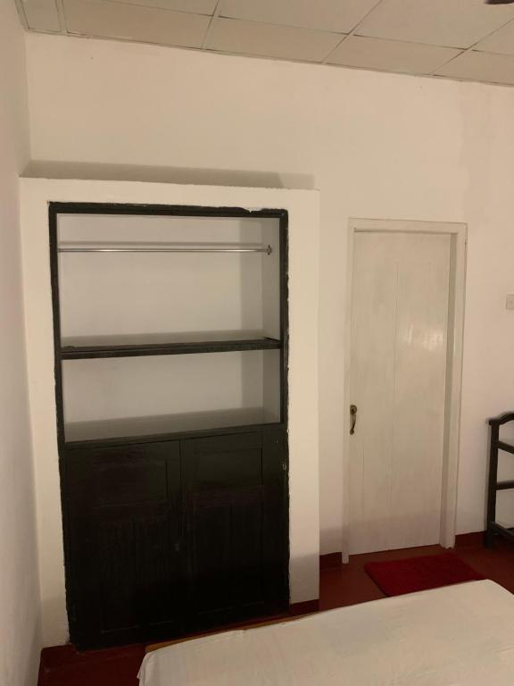 Postel nebo postele na pokoji v ubytování Unrushed Midigama