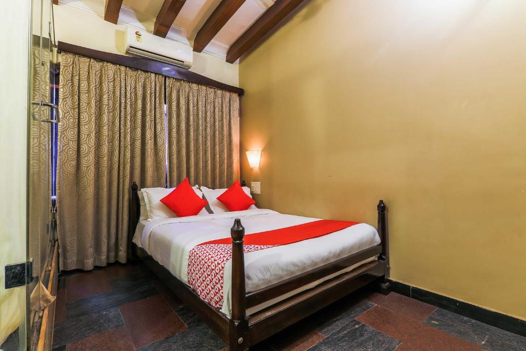 Postel nebo postele na pokoji v ubytování Hotel O Kams Coco De Parra