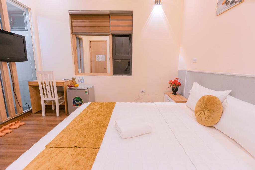 Postel nebo postele na pokoji v ubytování Golden Diamond Hotel