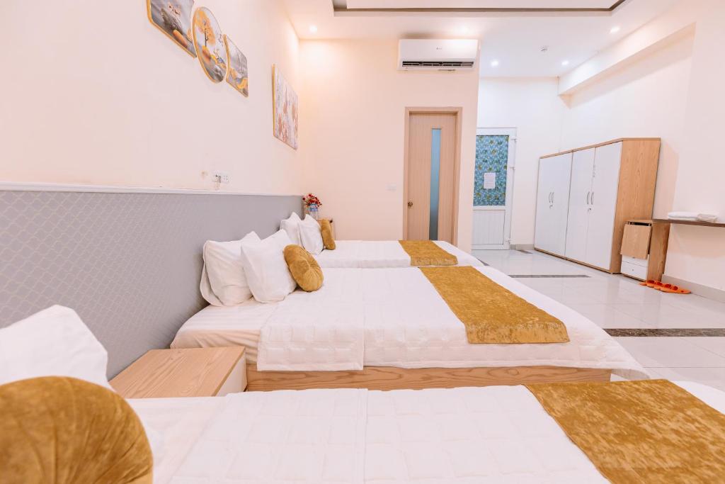 Postel nebo postele na pokoji v ubytování Golden Diamond Hotel