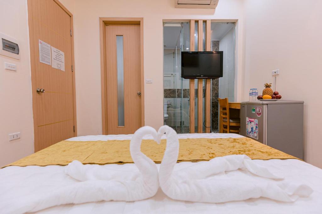 Postel nebo postele na pokoji v ubytování Golden Diamond Hotel