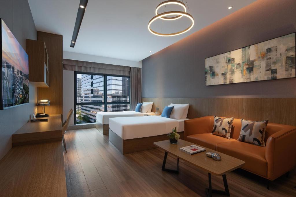 Postel nebo postele na pokoji v ubytování Atour Hotel Shenzhen Xili Innovation Valley