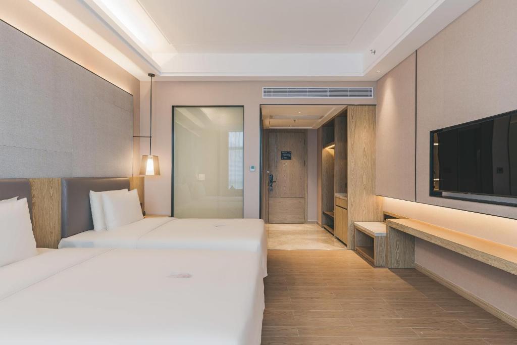 TV a/nebo společenská místnost v ubytování Atour Hotel Shenzhen Xili Innovation Valley