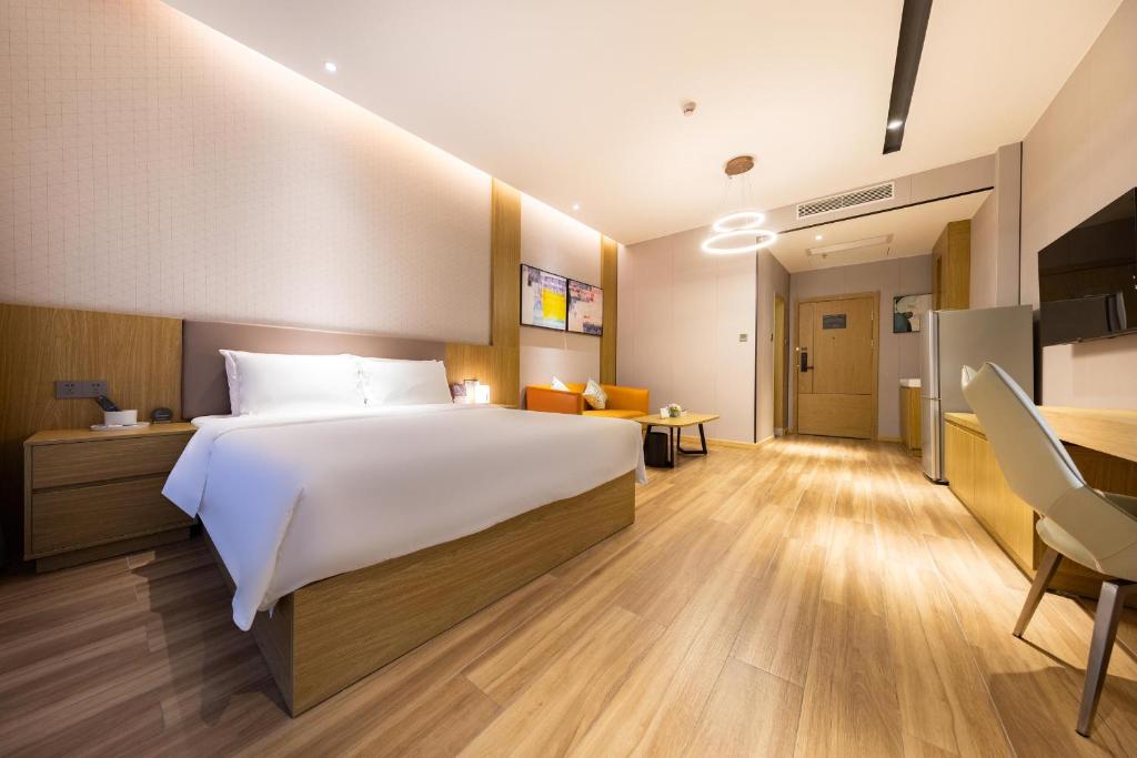 Postel nebo postele na pokoji v ubytování Atour Hotel Shenzhen Xili Innovation Valley