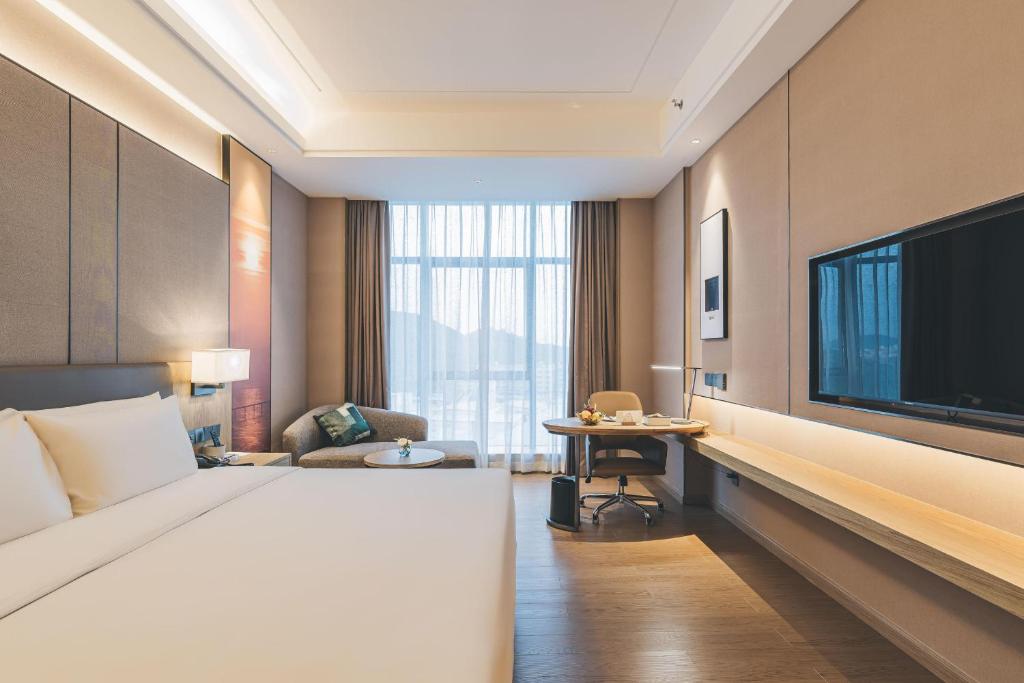 Postel nebo postele na pokoji v ubytování Atour Hotel Shenzhen Xili Innovation Valley