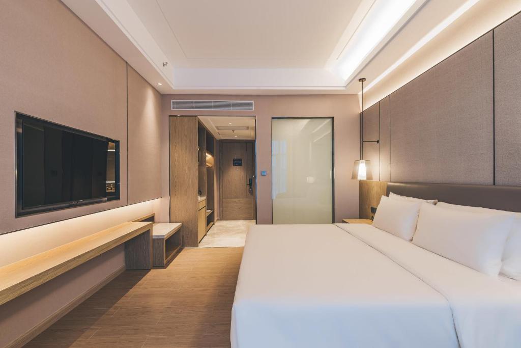 Postel nebo postele na pokoji v ubytování Atour Hotel Shenzhen Xili Innovation Valley