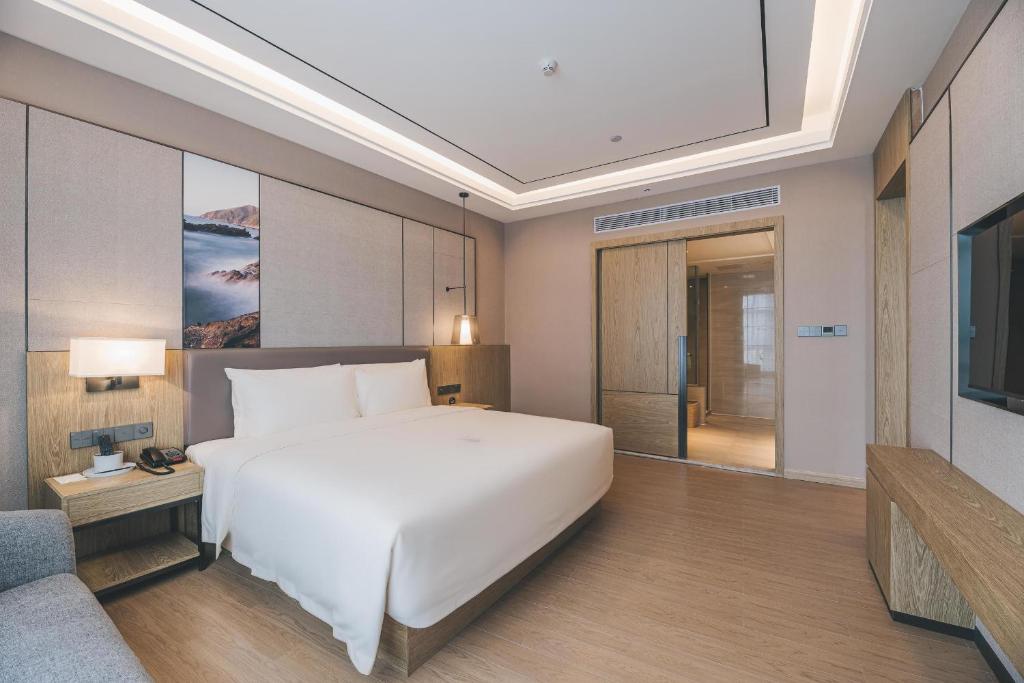 Postel nebo postele na pokoji v ubytování Atour Hotel Shenzhen Xili Innovation Valley