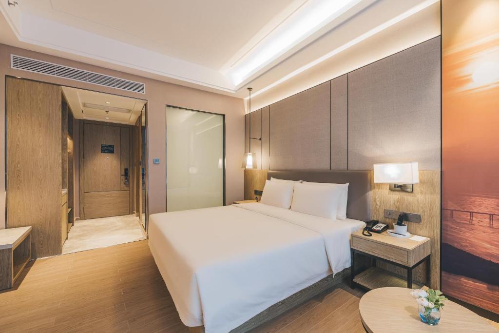 Postel nebo postele na pokoji v ubytování Atour Hotel Shenzhen Xili Innovation Valley