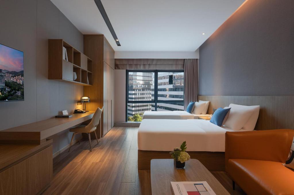 Postel nebo postele na pokoji v ubytování Atour Hotel Shenzhen Xili Innovation Valley