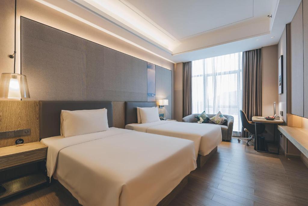 Postel nebo postele na pokoji v ubytování Atour Hotel Shenzhen Xili Innovation Valley