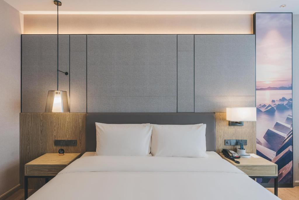 Postel nebo postele na pokoji v ubytování Atour Hotel Shenzhen Xili Innovation Valley
