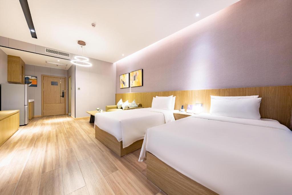 Postel nebo postele na pokoji v ubytování Atour Hotel Shenzhen Xili Innovation Valley