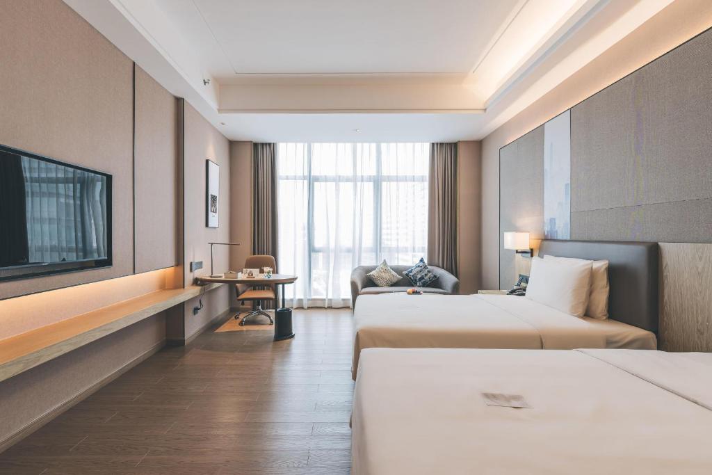 Postel nebo postele na pokoji v ubytování Atour Hotel Shenzhen Xili Innovation Valley