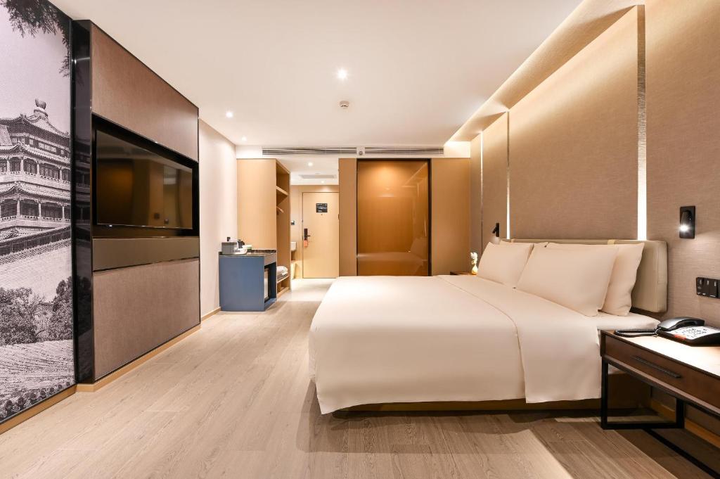Postel nebo postele na pokoji v ubytování Atour S Hotel Beijing Anzhen