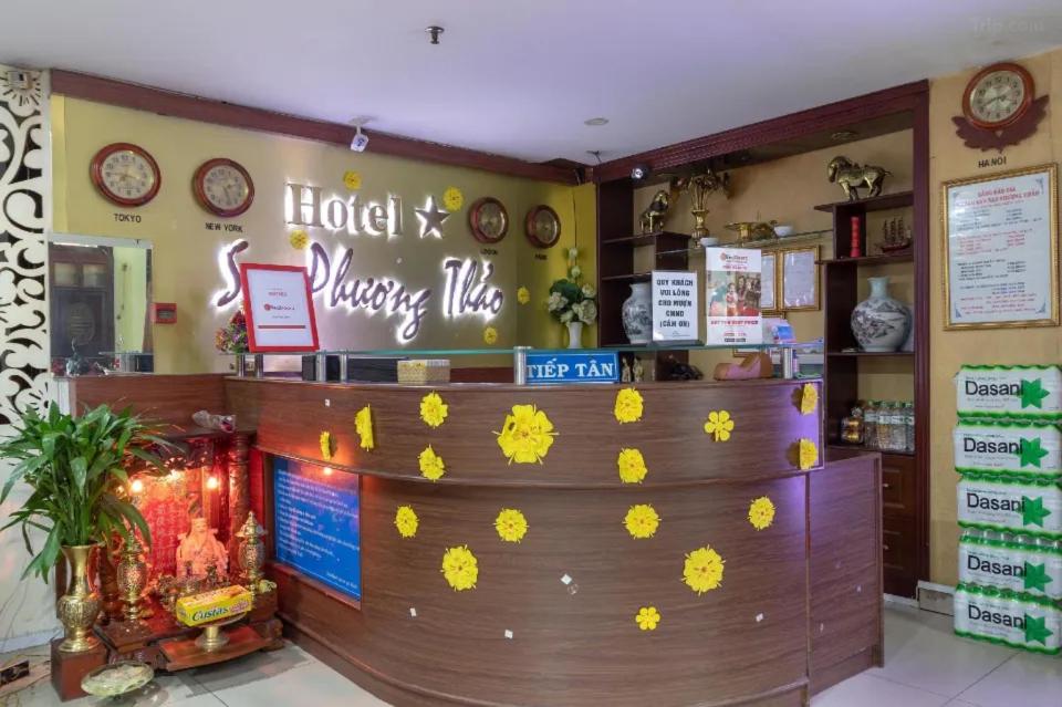 a restaurant with yellow flowers on the wall at Sao Phương Thảo Hotel - 140 Lê Thiệt - by Bay Luxury in Ho Chi Minh City